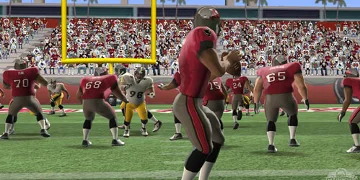 A player in red, retreating and preparing himself to throw the ball