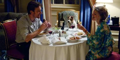 Oliver Fields Sat At A Dîner Table With Anna And A Dog