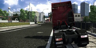 A truck parked at the side of the road with a puncture