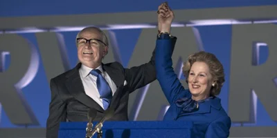 Jim Broadbent Holding Meryl Streep's Arm Up
